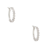 Silver hoop earrings with sparkling cubic zirconia stones set around the outer edge.
