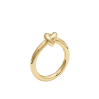 Gold ring with heart-shaped detail at the top.