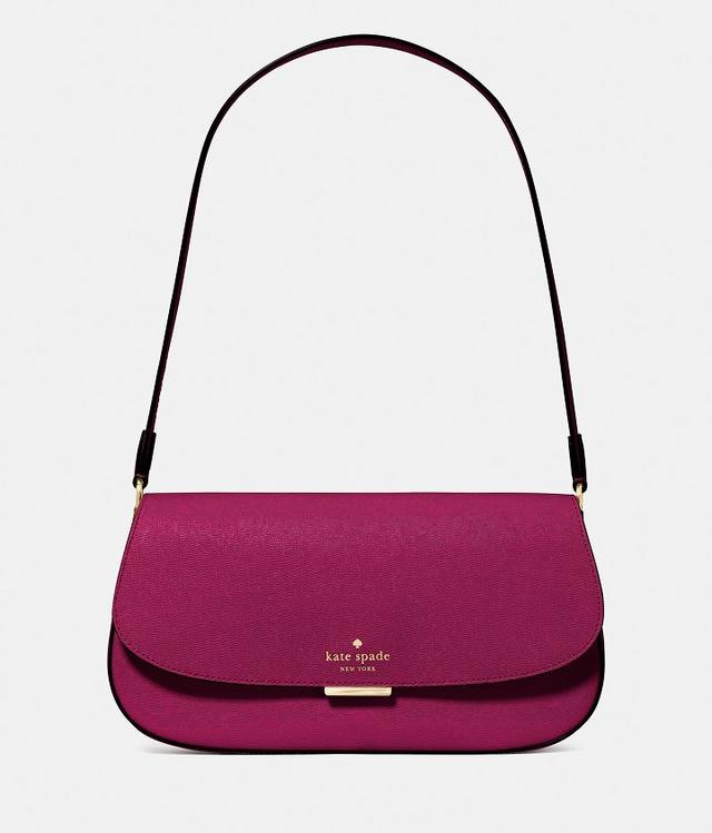 Kate Spade magenta shoulder bag with black strap and gold-tone hardware.
