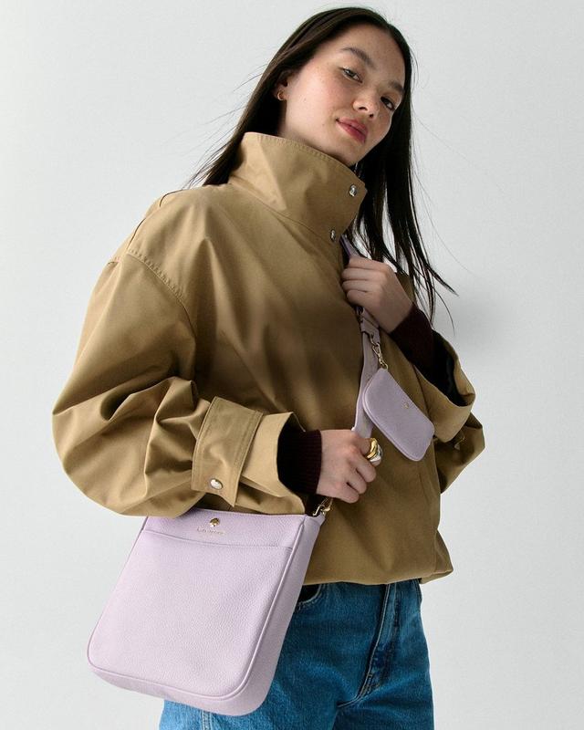 DOTD LEFT - woman standing with a pink kate spade bag