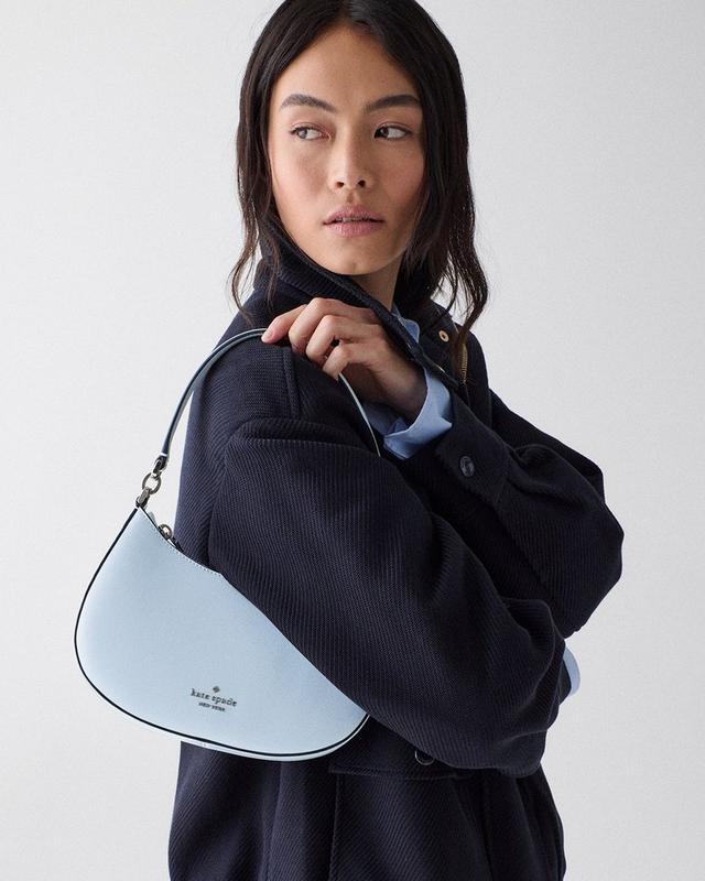 DOTD MAIN MEDIA - woman with a blue shoulder bag