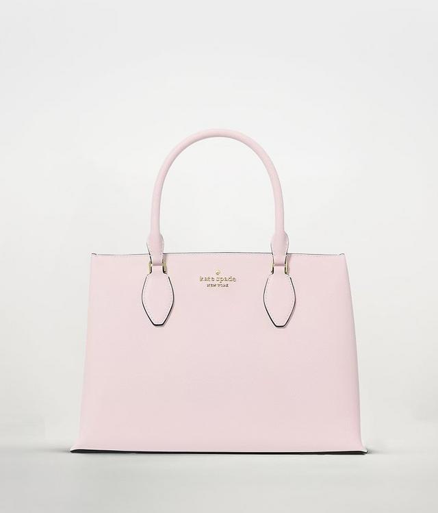 Kate Spade light pink structured tote bag with dual handles and gold logo plaque.