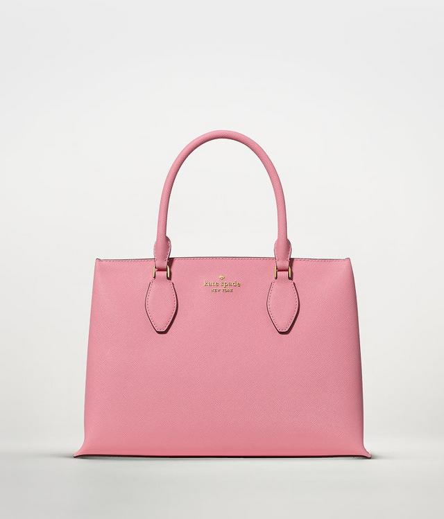 Pink Kate Spade structured tote bag with dual handles and gold logo hardware.
