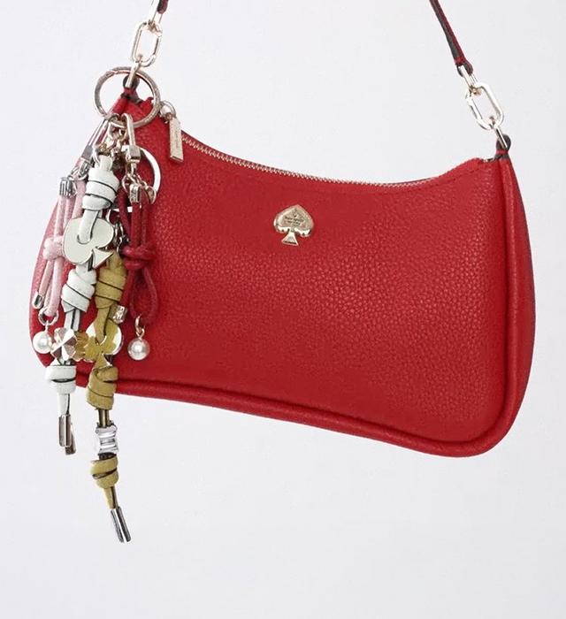 Red shoulder bag with bag charms